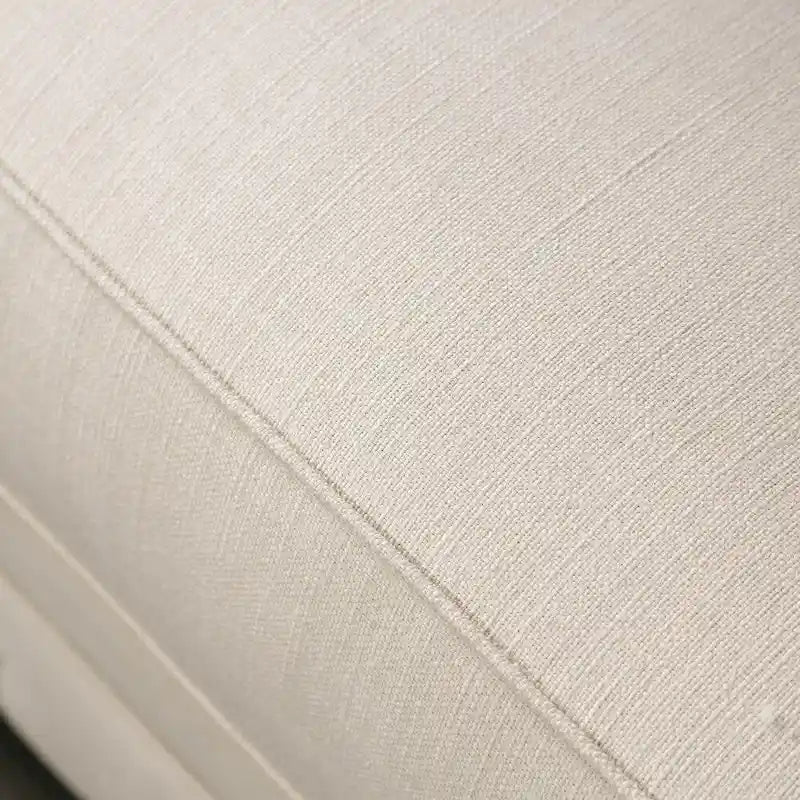 Canapé Cury Glam en tissu beige, capitonné avec garniture cloutée